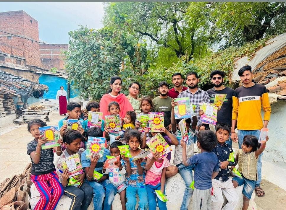 Underprivileged children smiling at a Vidyalok learning center